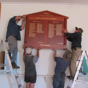 Hanging the Greta Hansonville Honour Board Oct 2015 (4)